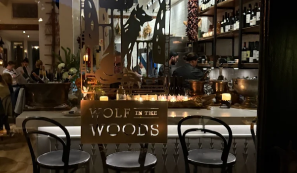 Cozy interior of Wolf in the Woods, one of the best restaurants in San Diego known for intimate dining and New Mexican-inspired cuisine.